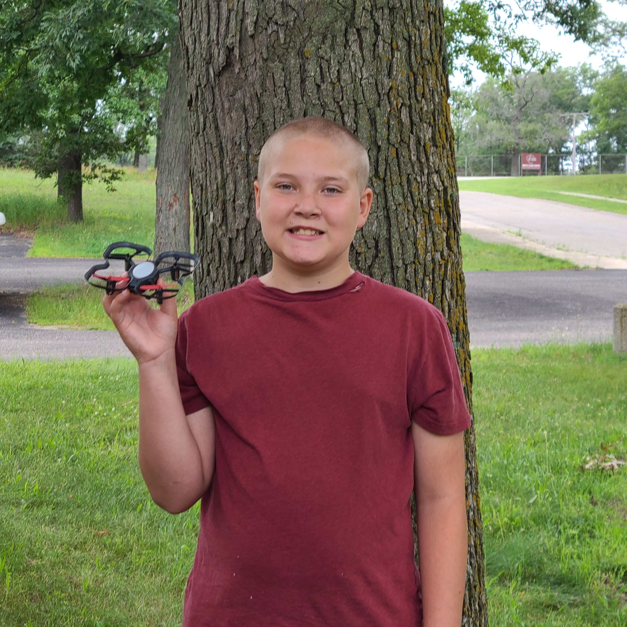 Trevor, holding a drone outside